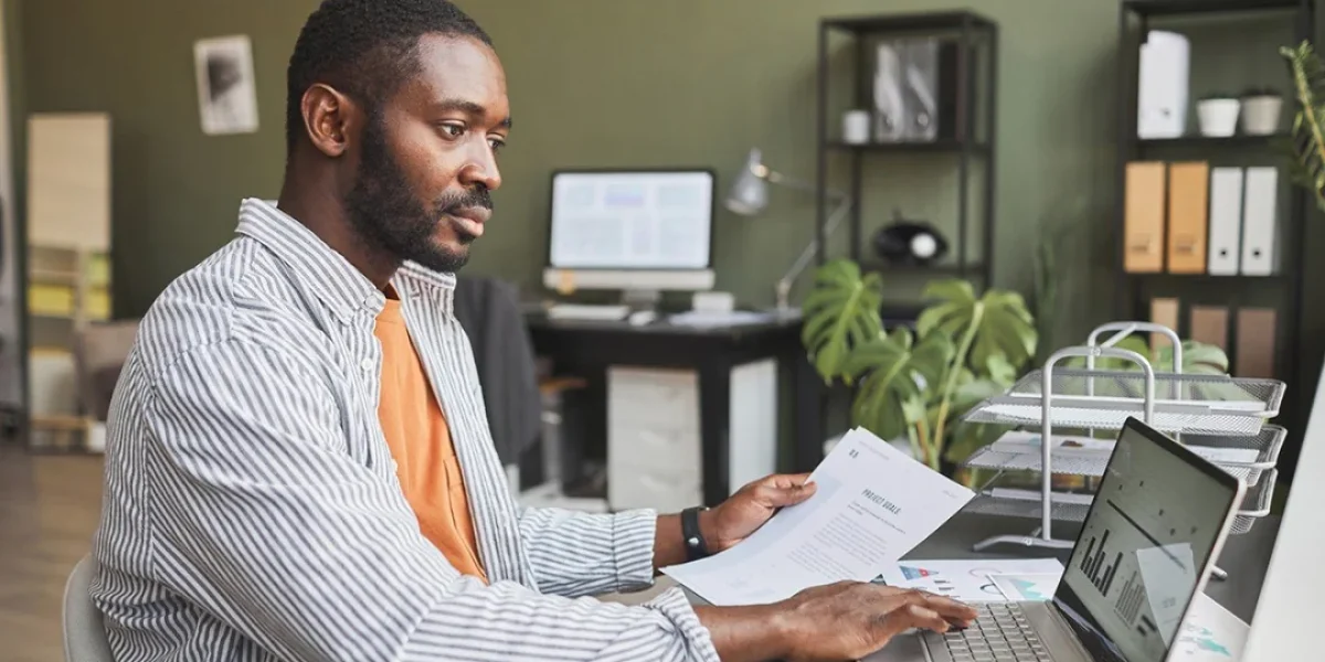 man working at a computer faces remote work security risks